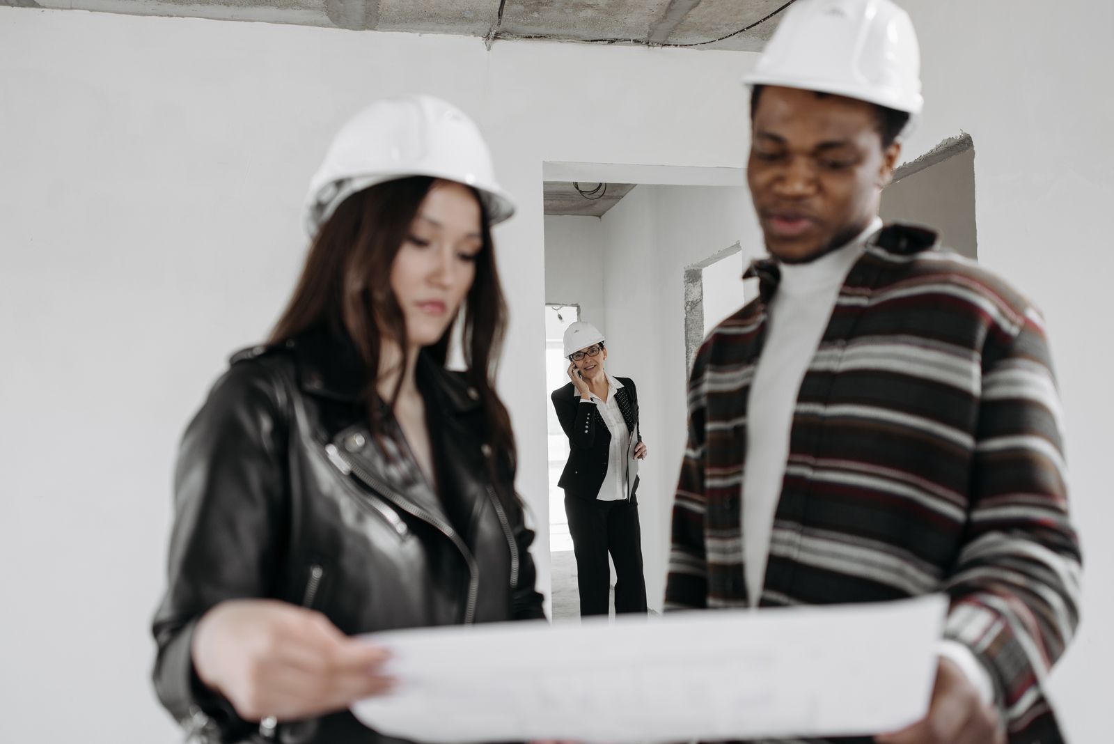 Professional contractor team discussing roof installation